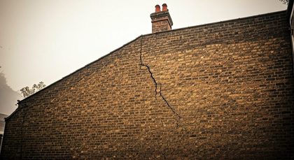 Cracked wall on side of property