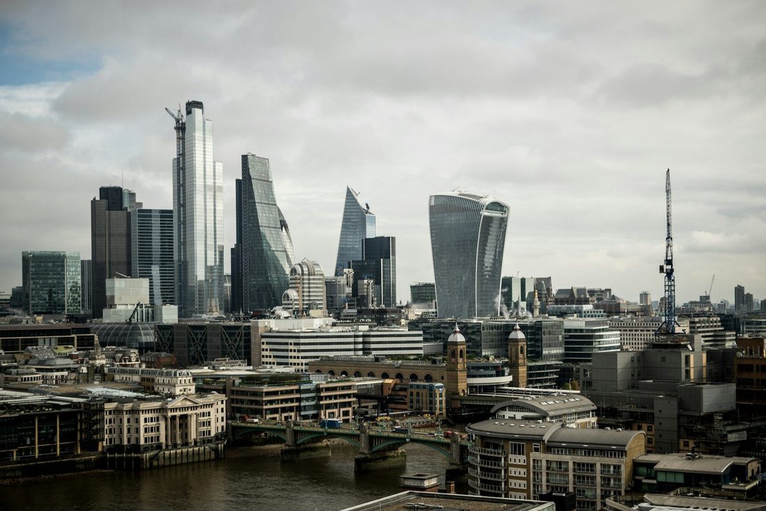 city buildings near body of water during daytime