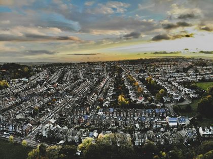 an aerial view of a city with lots of houses