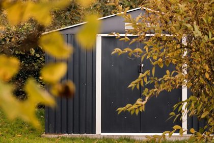 a small shed with a door and a window