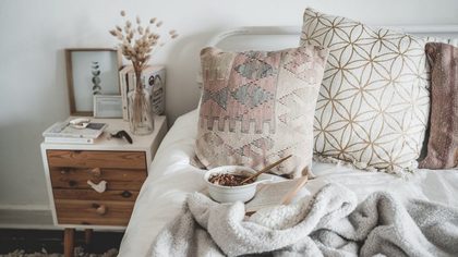 A Bowl of Breakfast in Bed over a Book