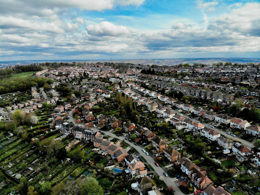 an aerial view of a city with lots of houses