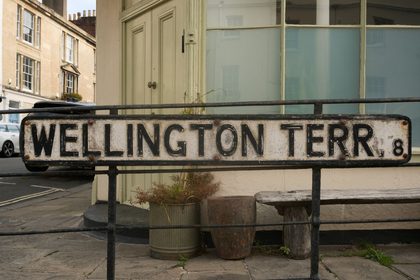 Rustic street sign for Wellington Terrace in Bristol, England showing an old-world charm.