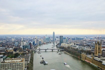 a river running through a city next to tall buildings