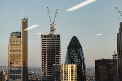 Through window of modern buildings under constructions
