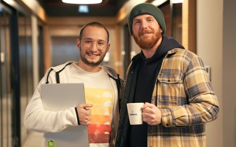 a couple of men standing next to each other