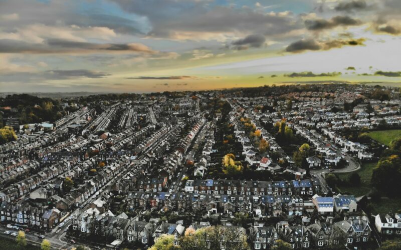 an aerial view of a city with lots of houses