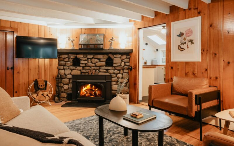 a living room filled with furniture and a fire place