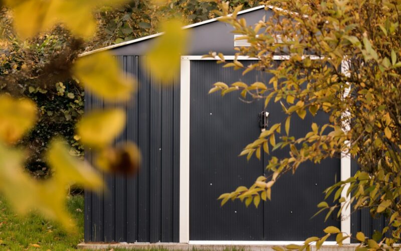 a small shed with a door and a window