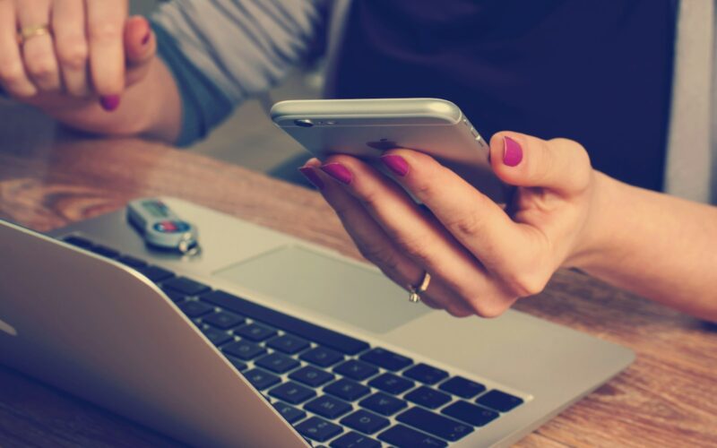 woman holding silver iPhone 6