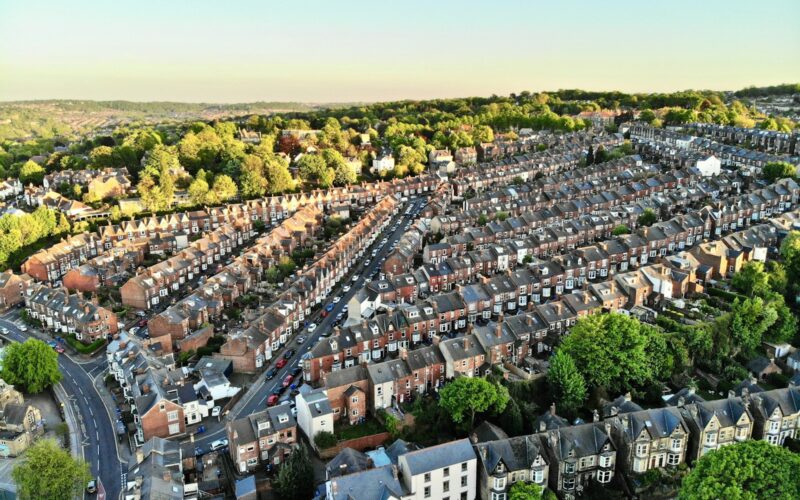 an aerial view of a city with lots of houses