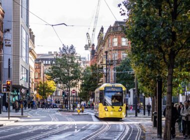 yellow and black tram on road during daytime