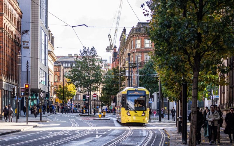 yellow and black tram on road during daytime