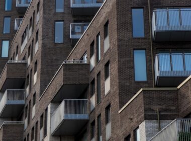 a tall brick building with balconies and balconies